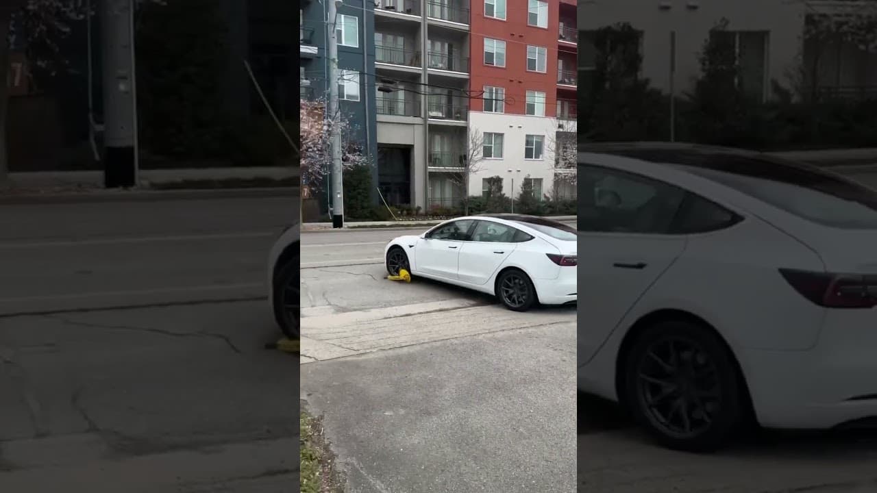 Absolute idiot drives away with boot on his wheel