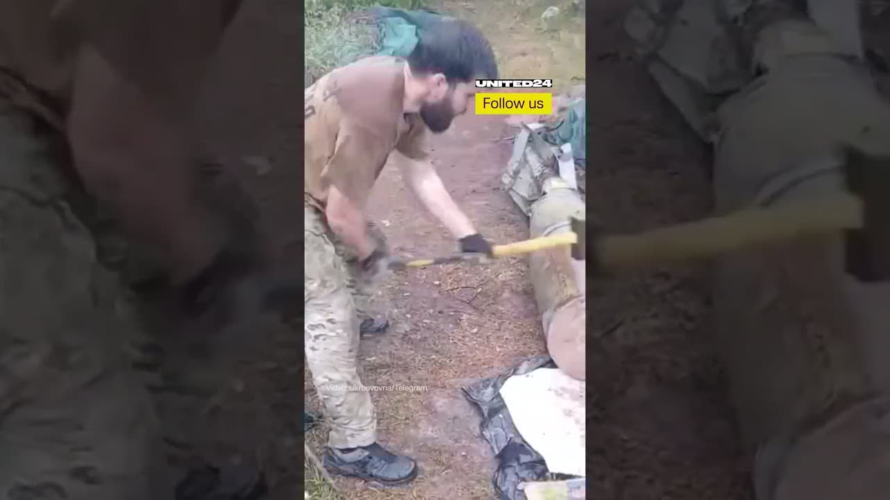 Ukrainian Soldier Removes Explosives From Russian Bomb With a Hammer #warinukraine